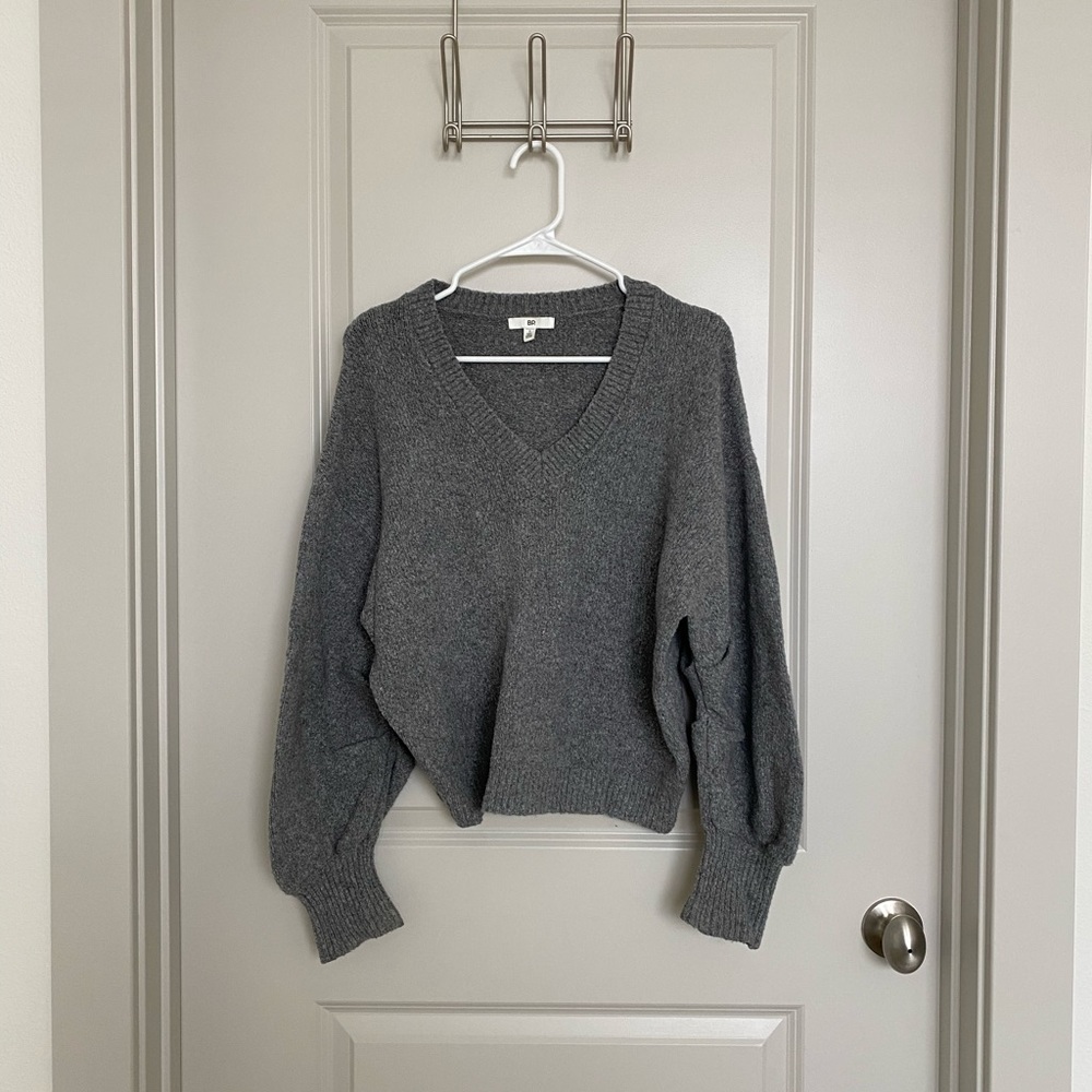 BP touches sleeve sweater